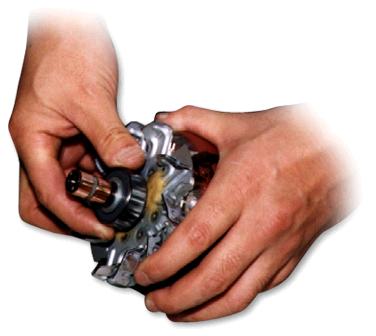 Close-up of hands holding a small metal object Description automatically generated