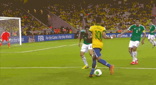 A group of men playing football Description automatically generated with medium confidence