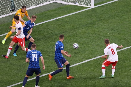 A group of men playing football Description automatically generated